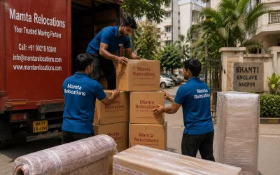 Movers stacking cartons outside a sunny Nagpur residential colony — Mamta Relocations