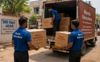 Movers loading cartons outside a Raipur colony on a dusty afternoon — Mamta Relocations