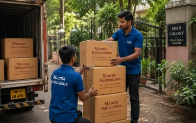 Movers stacking cartons outside a leafy Ranchi colony — Mamta Relocations